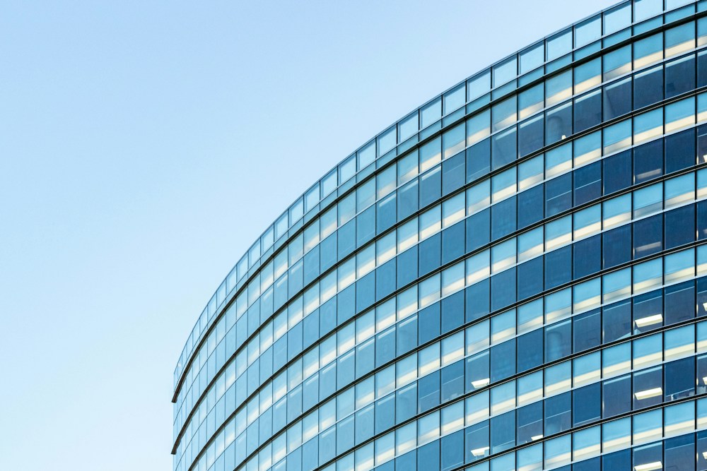 Curved glass facade illustrating technical consultancy