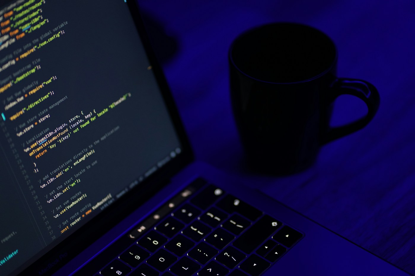 Laptop with a code editor on a desk